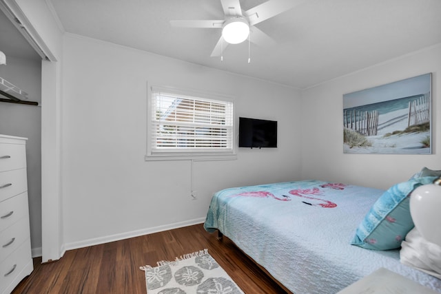 bedroom with ceiling fan and dark hardwood / wood-style floors