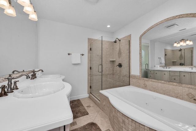 bathroom featuring tile patterned flooring, vanity, and separate shower and tub