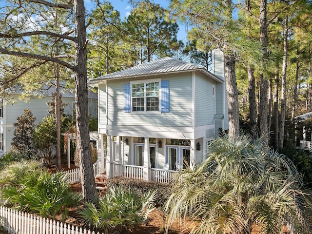 view of front of home featuring french doors and a porch