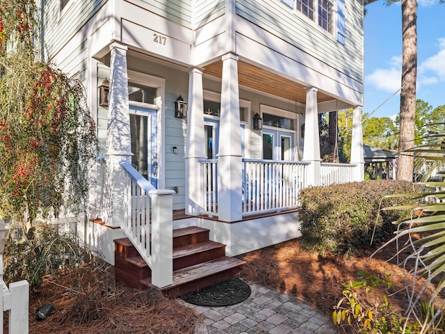 doorway to property featuring covered porch