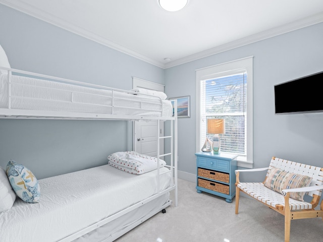 carpeted bedroom featuring ornamental molding