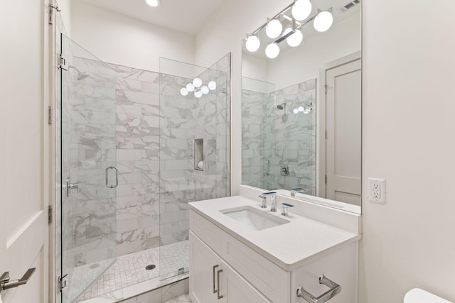 bathroom with vanity and an enclosed shower