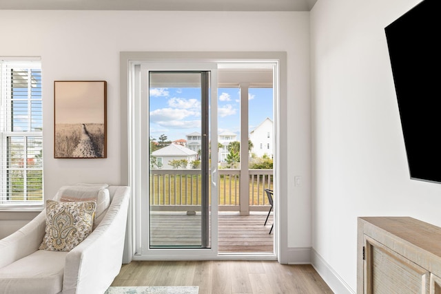 doorway with light hardwood / wood-style floors