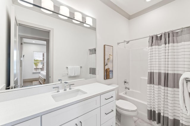 full bathroom featuring shower / bath combo with shower curtain, vanity, and toilet