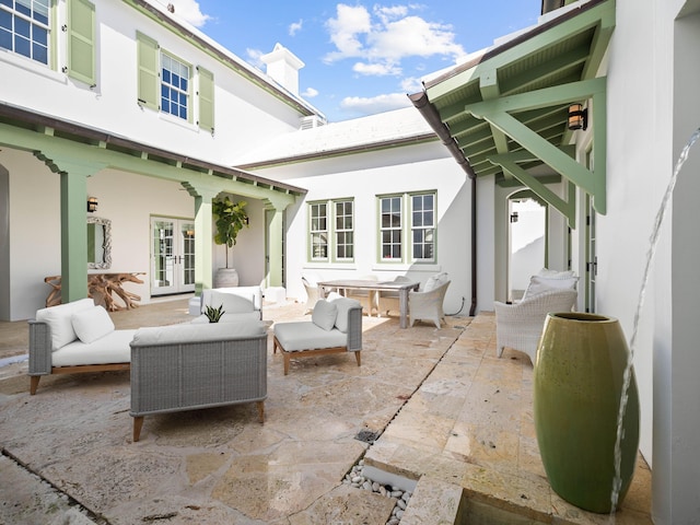 view of patio featuring outdoor lounge area and french doors