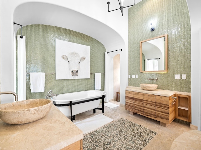 bathroom with vanity and a bathing tub