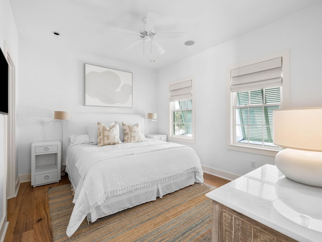 bedroom featuring hardwood / wood-style floors and ceiling fan