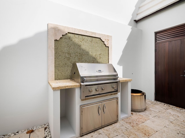 view of patio featuring a grill and an outdoor kitchen