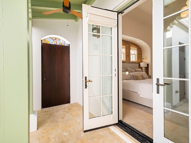 entryway featuring french doors and ceiling fan