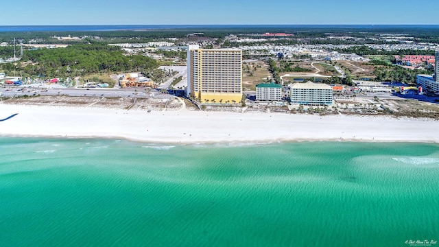 drone / aerial view with a beach view and a water view