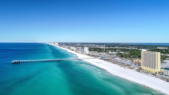 birds eye view of property with a water view and a view of the beach