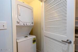 laundry room with stacked washer and clothes dryer