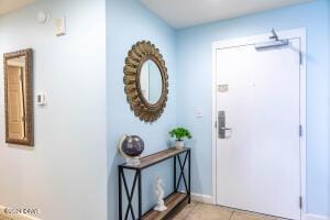 foyer featuring light tile patterned flooring