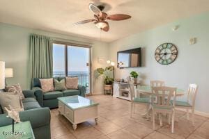 tiled living room with ceiling fan