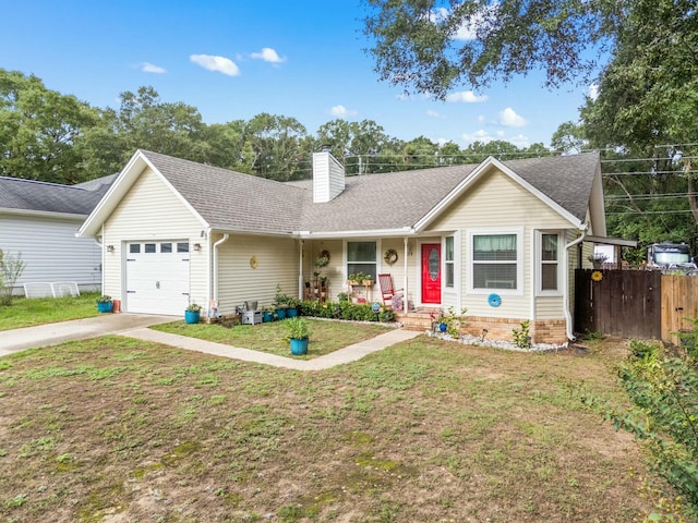 ranch-style home with a front yard and a garage