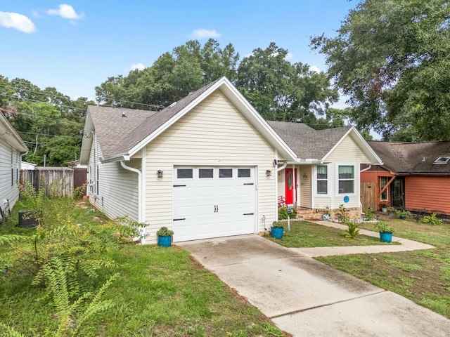 view of front of property with a front yard and a garage