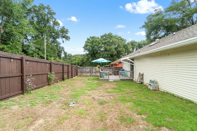 view of yard featuring a wooden deck