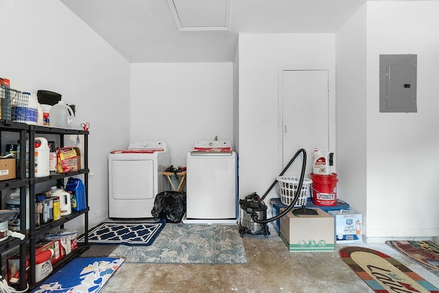 garage featuring separate washer and dryer and electric panel