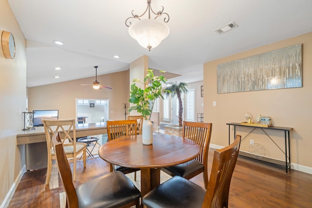 dining space featuring dark hardwood / wood-style flooring, ceiling fan, and lofted ceiling