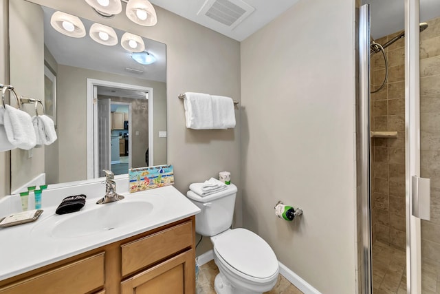 bathroom with an enclosed shower, vanity, and toilet