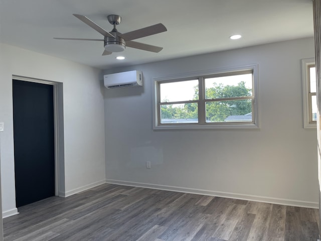 unfurnished room featuring ceiling fan, dark hardwood / wood-style flooring, and an AC wall unit