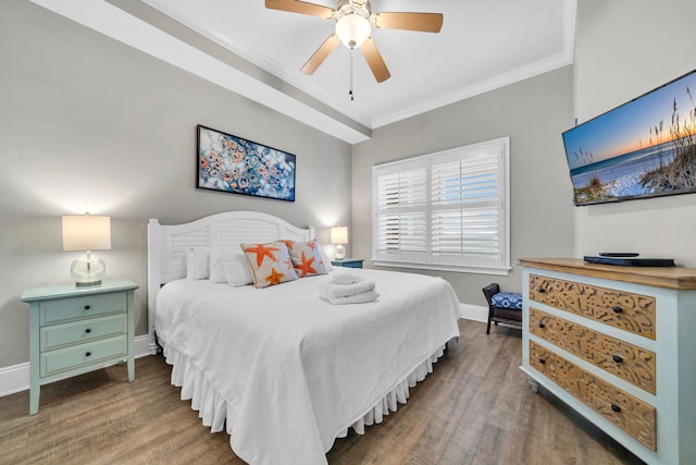 bedroom featuring wood-type flooring, ceiling fan, and crown molding