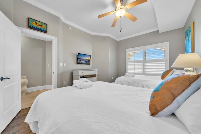 bedroom featuring ceiling fan, hardwood / wood-style floors, and ornamental molding