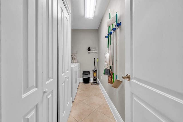 bathroom featuring tile patterned flooring and washer and dryer