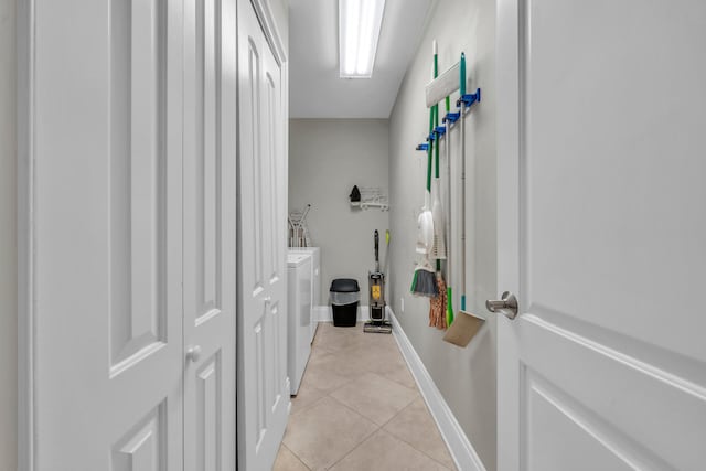 bathroom with tile patterned floors and washing machine and clothes dryer