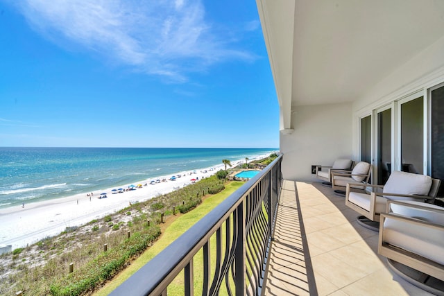 balcony with a view of the beach and a water view