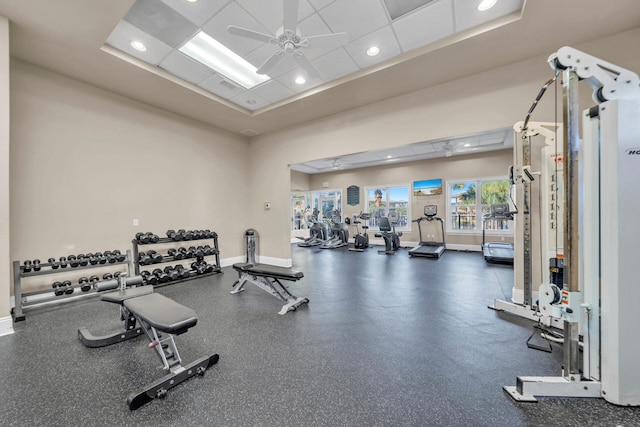 workout area with ceiling fan and a drop ceiling