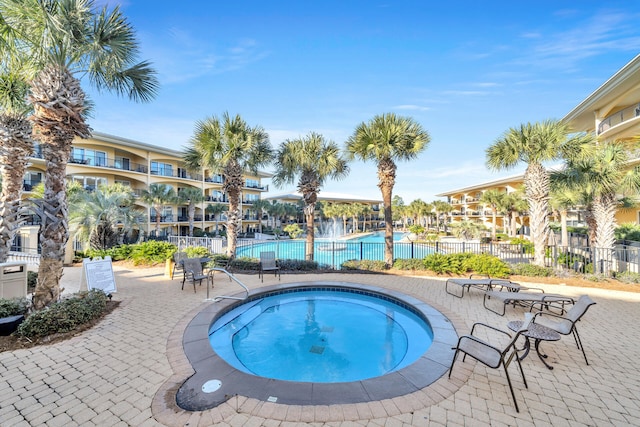 view of pool featuring a community hot tub