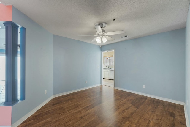 spare room featuring ceiling fan, hardwood / wood-style floors, a textured ceiling, and sink