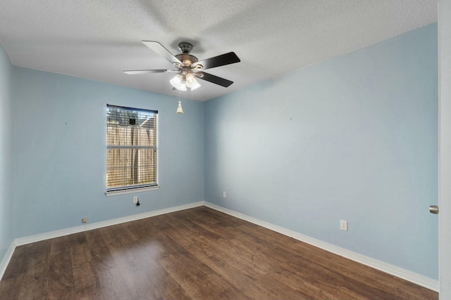 empty room with a textured ceiling, ceiling fan, and dark wood-type flooring