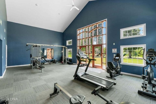 gym with high vaulted ceiling and ceiling fan