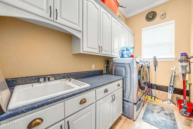 laundry room with cabinets, independent washer and dryer, light tile patterned floors, ornamental molding, and sink