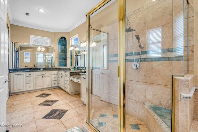 bathroom featuring vanity, walk in shower, tile patterned floors, and crown molding