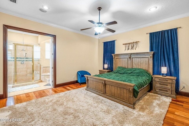 bedroom featuring ensuite bath, ceiling fan, crown molding, and wood-type flooring