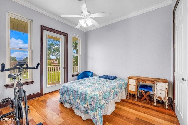 bedroom featuring access to outside, ceiling fan, light hardwood / wood-style floors, and multiple windows