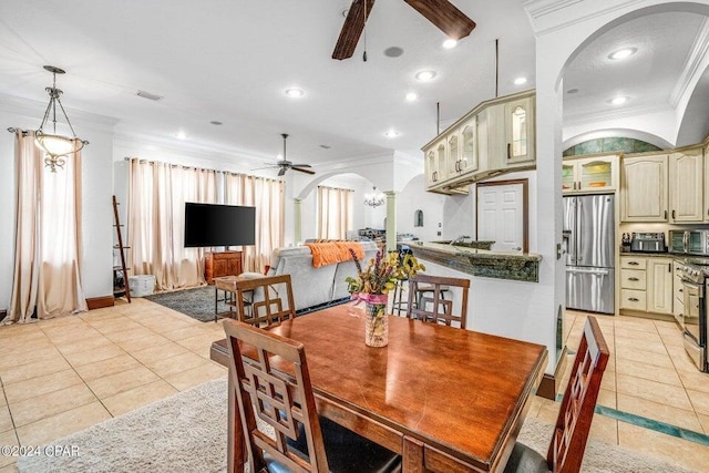 dining space featuring light tile patterned flooring, ornamental molding, and ceiling fan