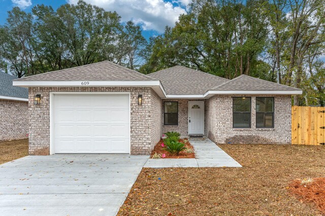 ranch-style home featuring a garage