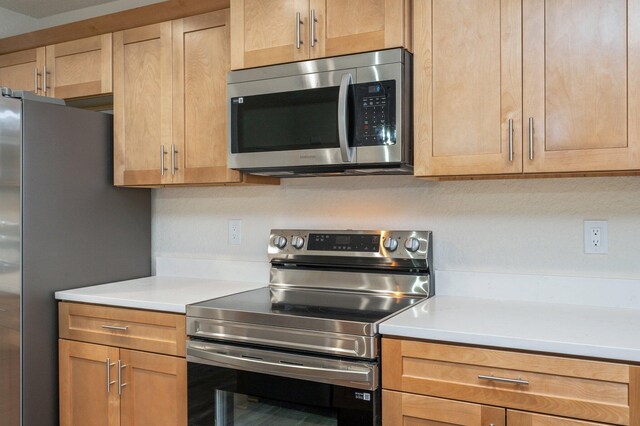 kitchen with appliances with stainless steel finishes