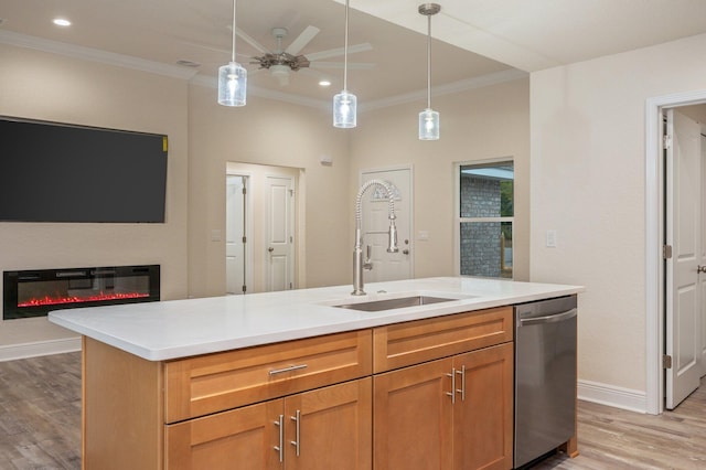 kitchen with dishwasher, a center island with sink, crown molding, and sink