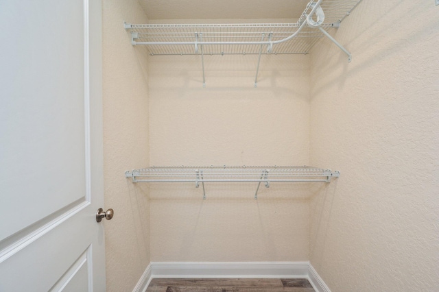 walk in closet featuring hardwood / wood-style floors