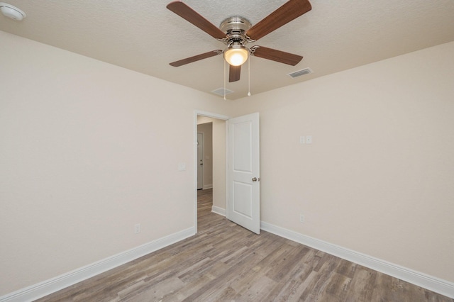 unfurnished room with light hardwood / wood-style flooring and ceiling fan