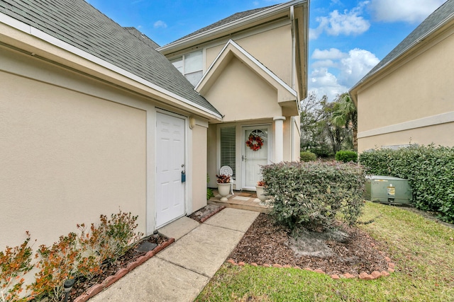 property entrance with a yard