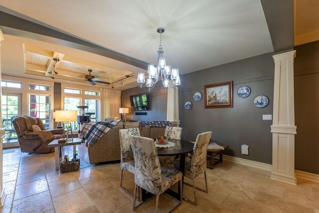 dining room with ceiling fan with notable chandelier and ornate columns