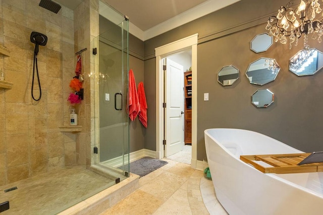 bathroom featuring crown molding, independent shower and bath, and an inviting chandelier