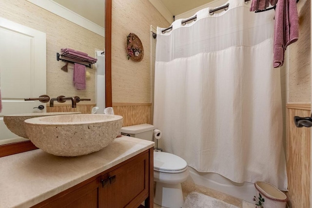 full bathroom featuring crown molding, shower / bath combination with curtain, toilet, wooden walls, and vanity