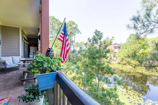 balcony featuring a water view